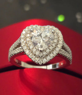 moissanite ring on a red background